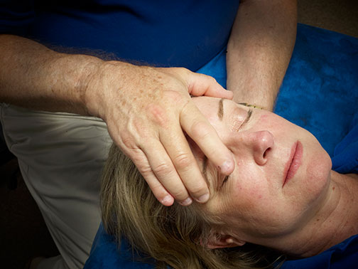 Picture of a person experiencing Cranial/Structural Therapy
